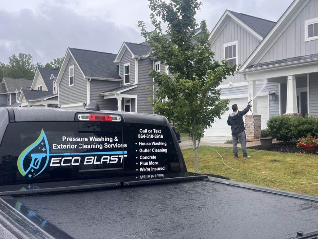 Professional house washing service by Eco Blast pressure washing a home in Greenville South Carolina