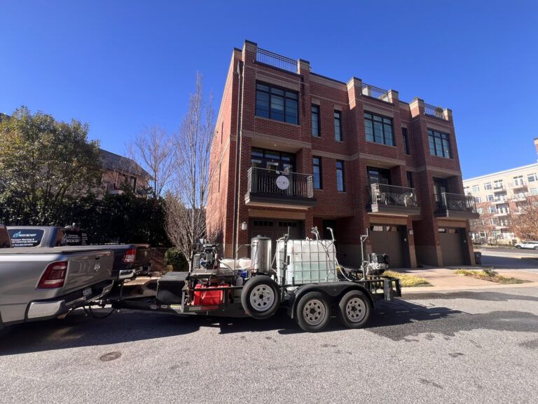 pressure washing crew at apartment building