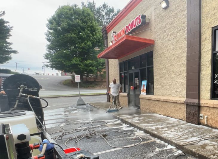 pressure washing crew at Dunkin' Donuts