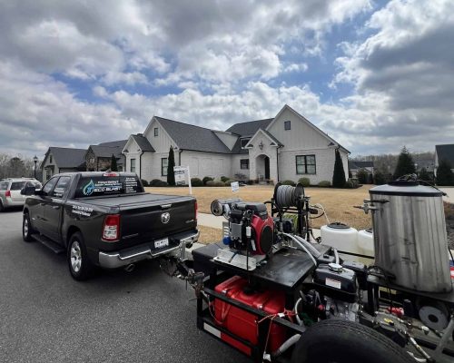 “Eco Blast Pressure Washing cleaning commercial building exterior in Greenville SC — professional soft washing and exterior cleaning services.”